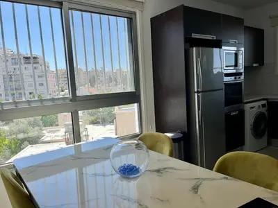 a kitchen with a table with a glass bowl on it at Cozy Stay Nicosia in Nicosia