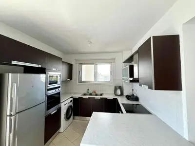 a kitchen with a stainless steel refrigerator and a dishwasher at Cozy Stay Nicosia in Nicosia