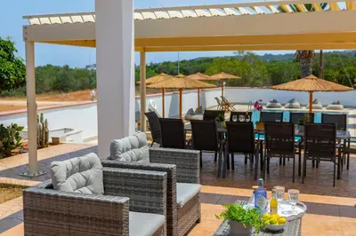 a patio with chairs and a table with a view at Protaras Views Villa PRAM1 in Protaras