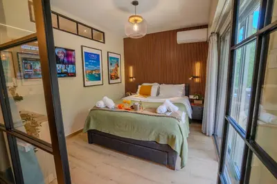 a bedroom with a bed with towels on it at 1 BDR New Boutique & Prime Location in Limassol