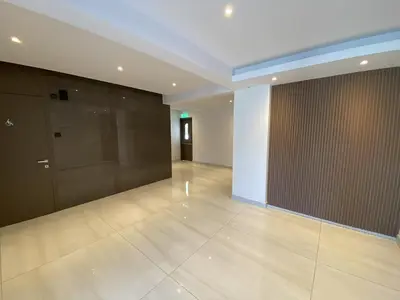 a large room with a large door and a tile floor at 1 bedroom 104 in Limassol