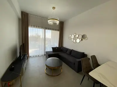 a living room with a couch and a table at 1 bedroom 104 in Limassol