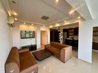 a living room with a couch and a table at Sunny Stay 2 Bdr near the sea Platform 357 in Limassol