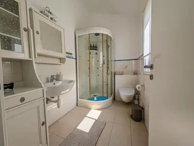 a bathroom with a shower and a sink and a toilet at Fig Tree Bay Villa Elena in Protaras
