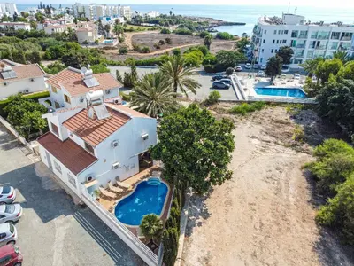 an aerial view of a house with a swimming pool at Fig Tree Bay Villa Elena in Protaras