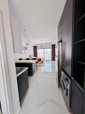 a kitchen with a washer and dryer in a room at Modern Luxury Apartment in Aglantzia