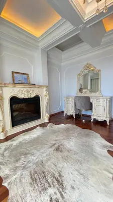 a living room with a fireplace and a large rug at Kingdom Villa with Sauna and Hamam in Kaimakli