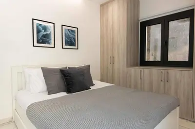 a bedroom with a large bed with a window at Kakopetria Luxury Villa w pool in Kakopetria