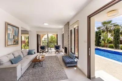 a living room with a couch and a table at Ayia Napa Luxury Seaside Villa Ionion H15 in Ayia Napa