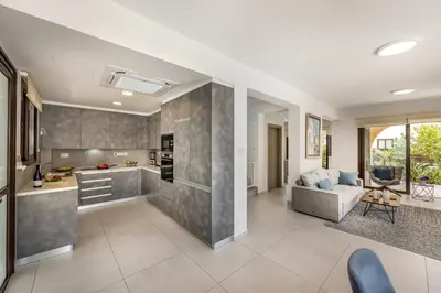 an open kitchen and living room in a house at Ayia Napa Luxury Seaside Villa Ionion H15 in Ayia Napa
