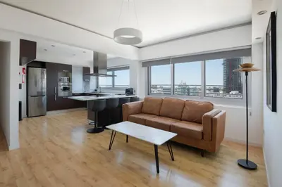 a living room with a couch and a table at Urban Condo 10th Floor - 2 Bdr in Nicosia