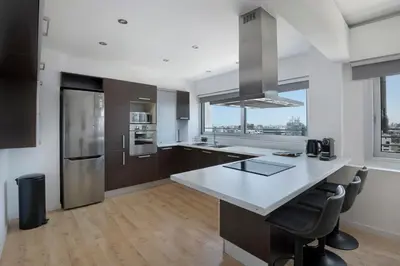 a kitchen with a large island in a kitchen at Urban Condo 10th Floor - 2 Bdr in Nicosia