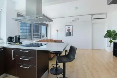 a kitchen with a kitchen island with a counter top at Urban Condo 10th Floor - 2 Bdr in Nicosia