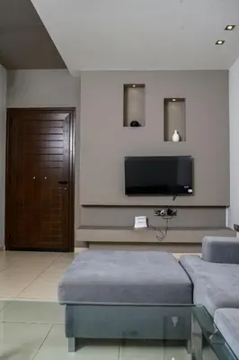 a living room with a couch and a flat screen tv at City Center Flat 23 in Larnaka