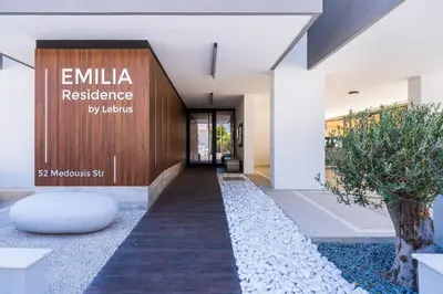 a building with a sign that reads emiliares residence at Lunette - Artful 1-BR Apartment & Balcony in Larnaca in Larnaka