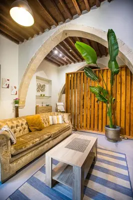 a living room with a couch and a coffee table at Atelier Residences by Sweet Keys in Limassol