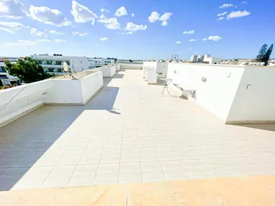 a balcony with a bench on top of a building at Awaken Your Divine Self Sacred Self Discovery Retreat in Ayia Napa Cyprus in Ayia Napa