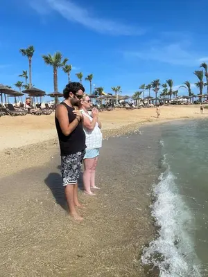 a man and a woman standing on the beach at Awaken Your Divine Self Sacred Self Discovery Retreat in Ayia Napa Cyprus in Ayia Napa