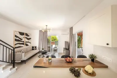 a living room with a couch and a table at Larnaca Seaside Villa Marina 44 in Pervolia