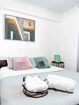 a bedroom with a bed with two towels on it at Ikarus in Limassol