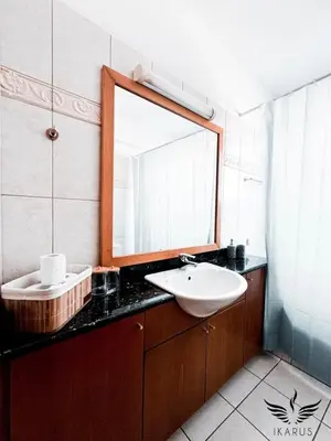 a bathroom with a sink and a mirror at Ikarus in Limassol