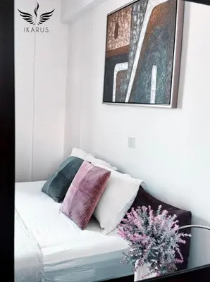 a white couch with pillows on it in a room at Ikarus in Limassol