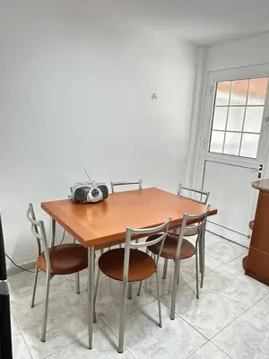 a dining room table with four chairs around it at Sunrise Maisonette in Voroklini