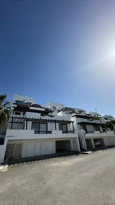 a large white building with a lot of windows at Kyrenia 2 bedroom apartment in Ayios Dhometios