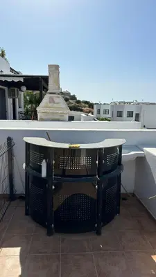 a table on top of a patio on a house at Kyrenia 2 bedroom apartment in Ayios Dhometios