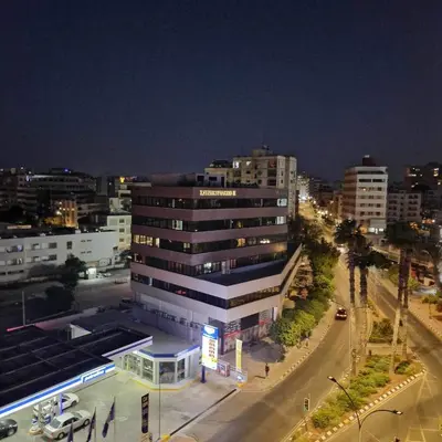 a view of a city at night with a building at Kallisti 2bd Central Stay - Wow View in Nicosia