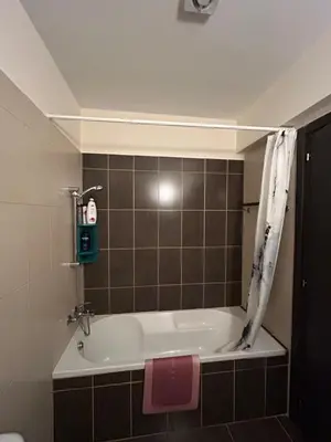 a bathroom with a bath tub in a room at Modern 2BR Appartment near Finikoudes beach - Larnaka in Larnaka