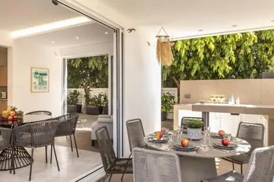 a dining room with a table and chairs at Protaras El Sol Villa in Protaras