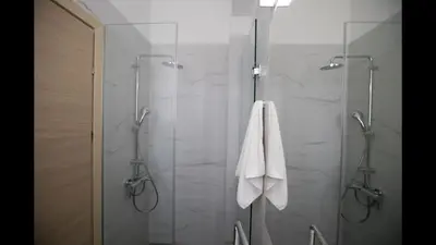 a bathroom with a shower with a white towel at Villa Prcv614, Luxury 6bdr Protaras Villa with Pool and Panoramic Sea views in Protaras