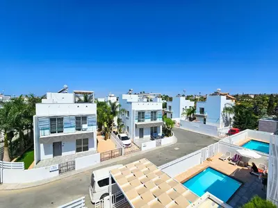 an aerial view of a building with two swimming pools at Nissi beach villa Azure in Ayia Napa