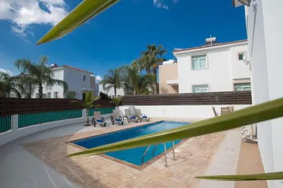 a swimming pool in the middle of a building at Protaras Holiday Villa Me25 in Protaras