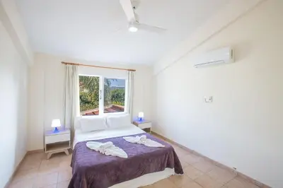 a bedroom with a bed and a window at Ayia Napa Holiday Villa At26 in Ayia Napa
