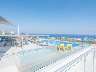 a balcony with a view of the ocean at Villa Clea,stunning 4bdr Protaras Villa, Seaviews in Protaras