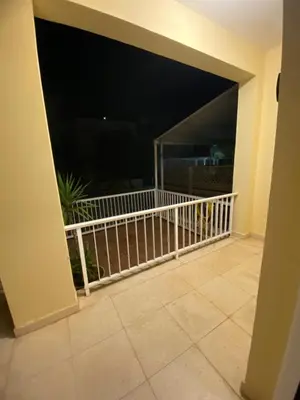 a view of a balcony at night with a fence at Sunny 2BR Home in Paralimni Near Beaches,Protaras! in Paralimni