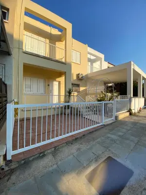 a white fence in front of a house at Sunny 2BR Home in Paralimni Near Beaches,Protaras! in Paralimni