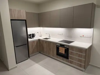 a kitchen with a sink and a stove top oven at Modern Cosy Holiday Apartment in Paralimni