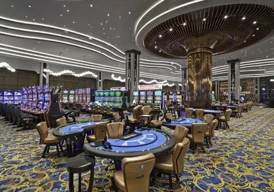 a casino with tables and chairs in a casino at Grand Sapphire Luxury Residence in Iskele