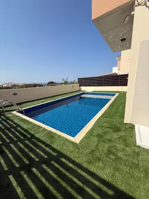 a swimming pool on the roof of a house at Dene Hollow kapparis in Paralimni