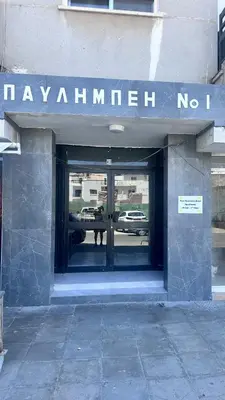 a building with a sign that reads mayanillian no at Near Finikoudes beach 1 in Larnaka
