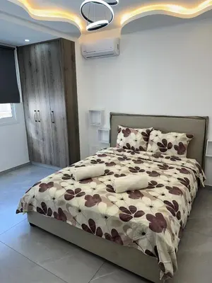 a bedroom with a large bed in a room at Near Finikoudes beach 1 in Larnaka