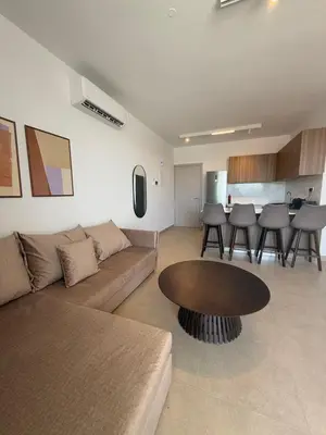 a living room with a couch and a table at Kroisou Comfort Stay 2 BEDROOM in Ayios Dhometios