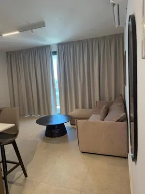 a living room with a couch and a table at Kroisou Comfort Stay 2 BEDROOM in Ayios Dhometios