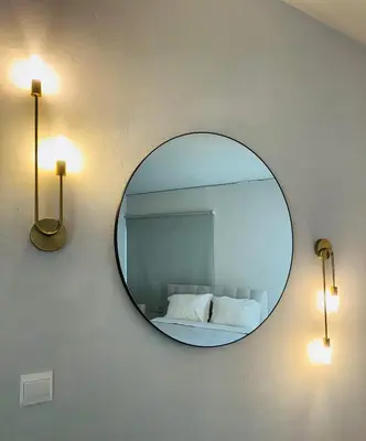 a mirror on a wall with a bed in a room at Kallisti 1bd Central Stay - Wow View in Nicosia