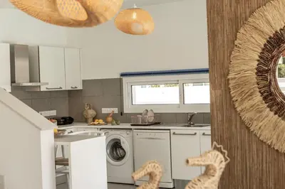 a kitchen with a washer and dryer at SeaSalt Villa in Paralimni