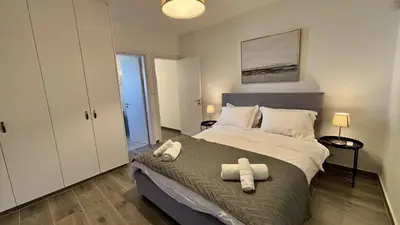 a bedroom with a bed with two towels on it at Sunrise Villa with Pool by TrulyCyprus in Pervolia
