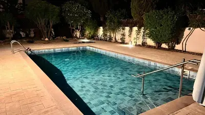 a swimming pool in a yard at night at Villa Porta Aurea in Ayia Napa